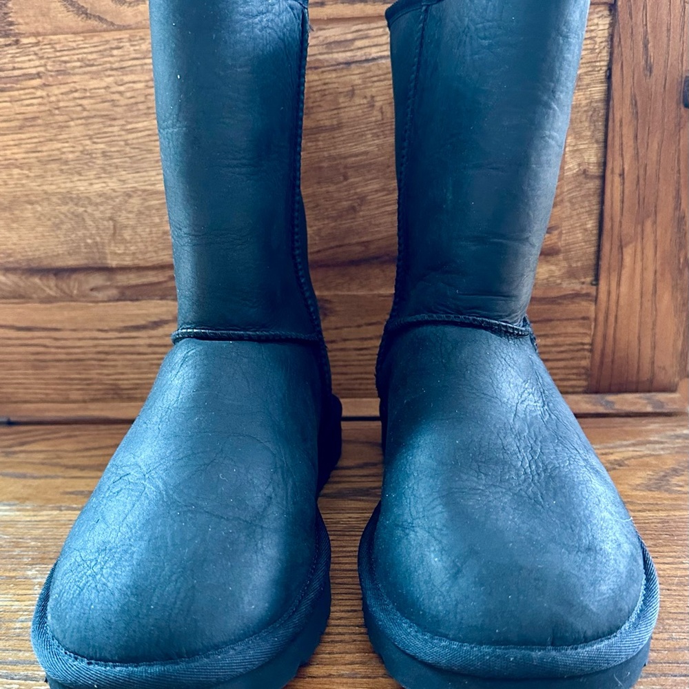 Ugg Classic short II, size 9, black leather. Brand new and never worn.